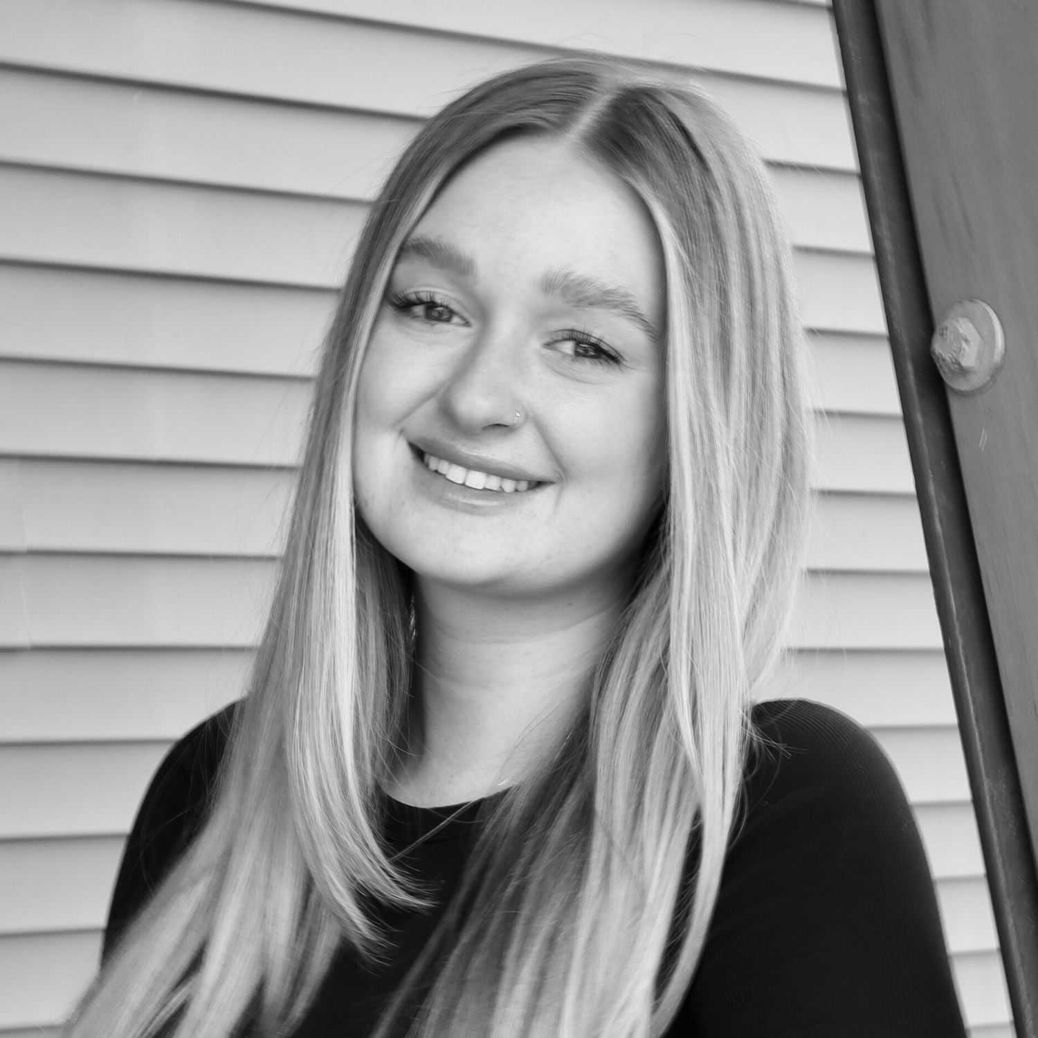 Portrait of Faith R., a professional stylist at Revive Salon & Spa, showcasing their expertise and style.