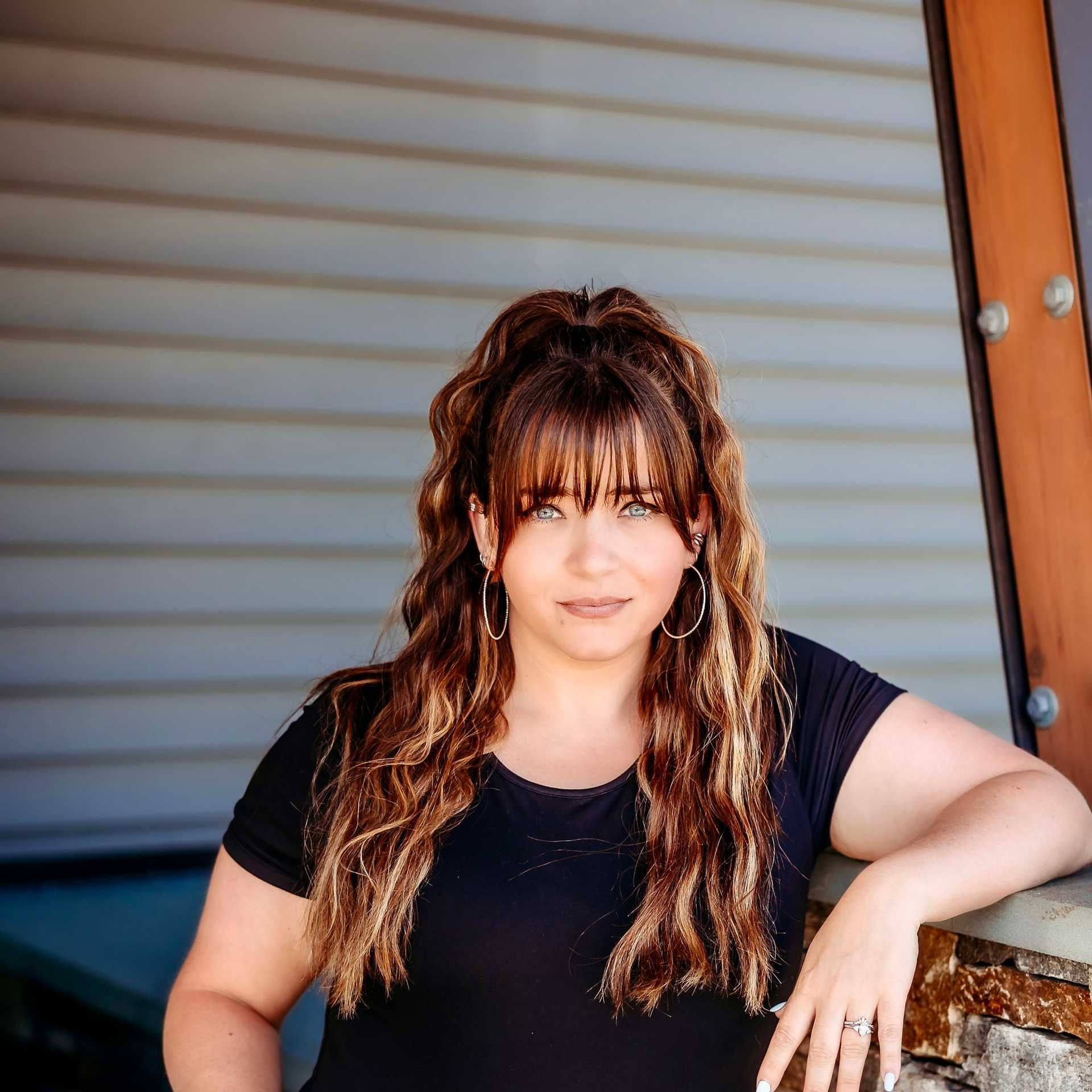 Portrait of Candice S., a professional stylist at Revive Salon & Spa, showcasing their expertise and style.