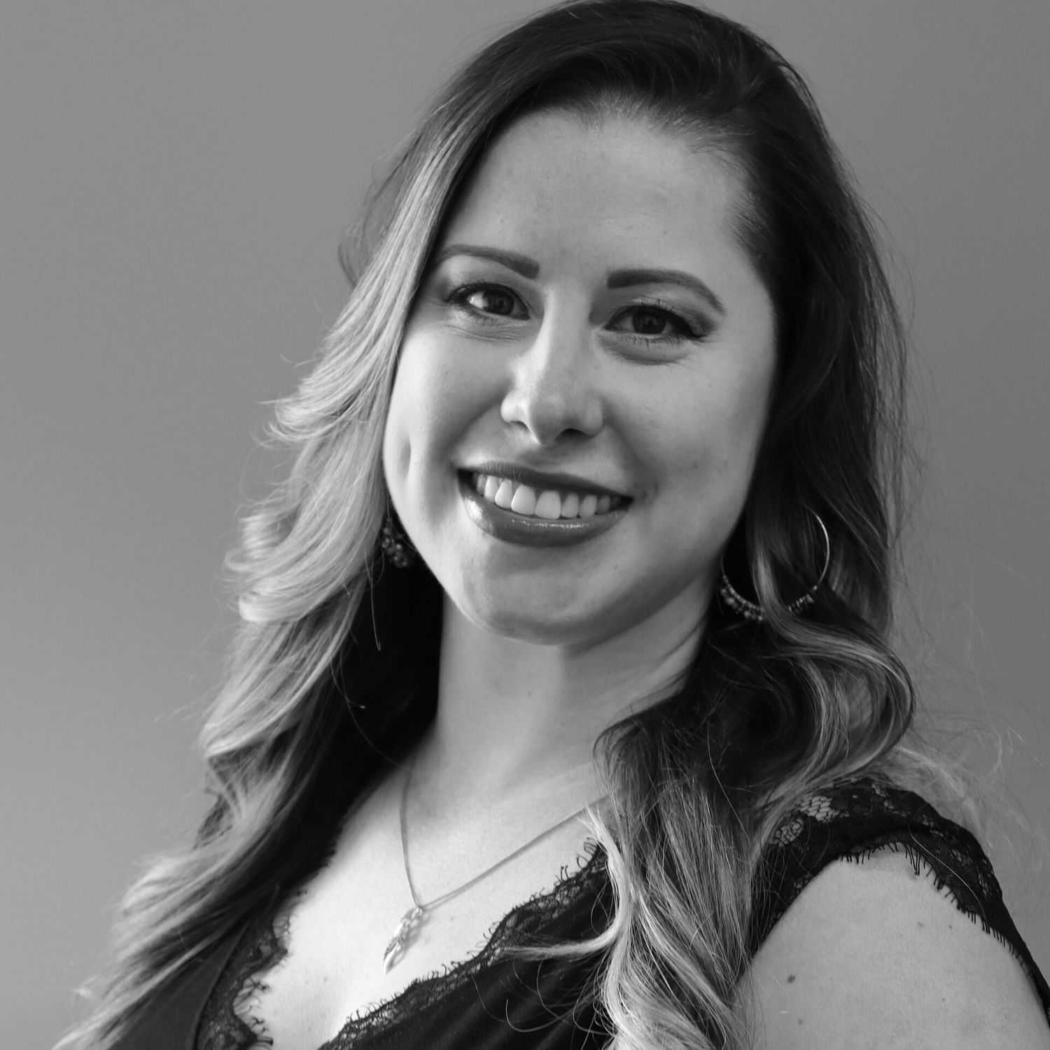 Portrait of Danielle M., a professional stylist at Revive Salon & Spa, showcasing their expertise and style.