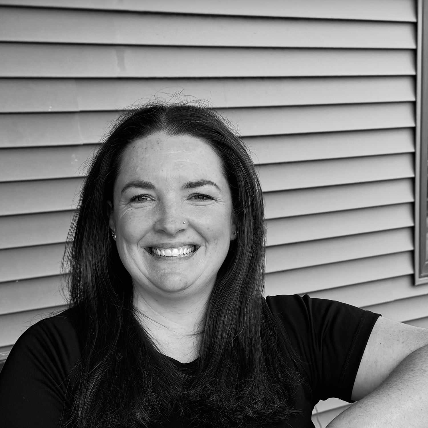 Portrait of Amanda J., a professional stylist at Revive Salon & Spa, showcasing their expertise and style.