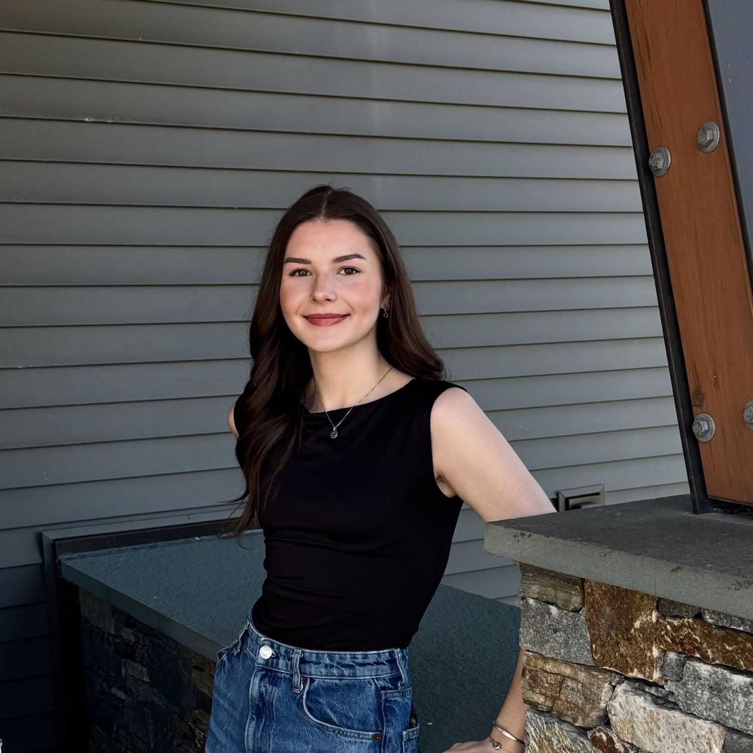 Portrait of Sophia M., a professional stylist at Revive Salon & Spa, showcasing their expertise and style.