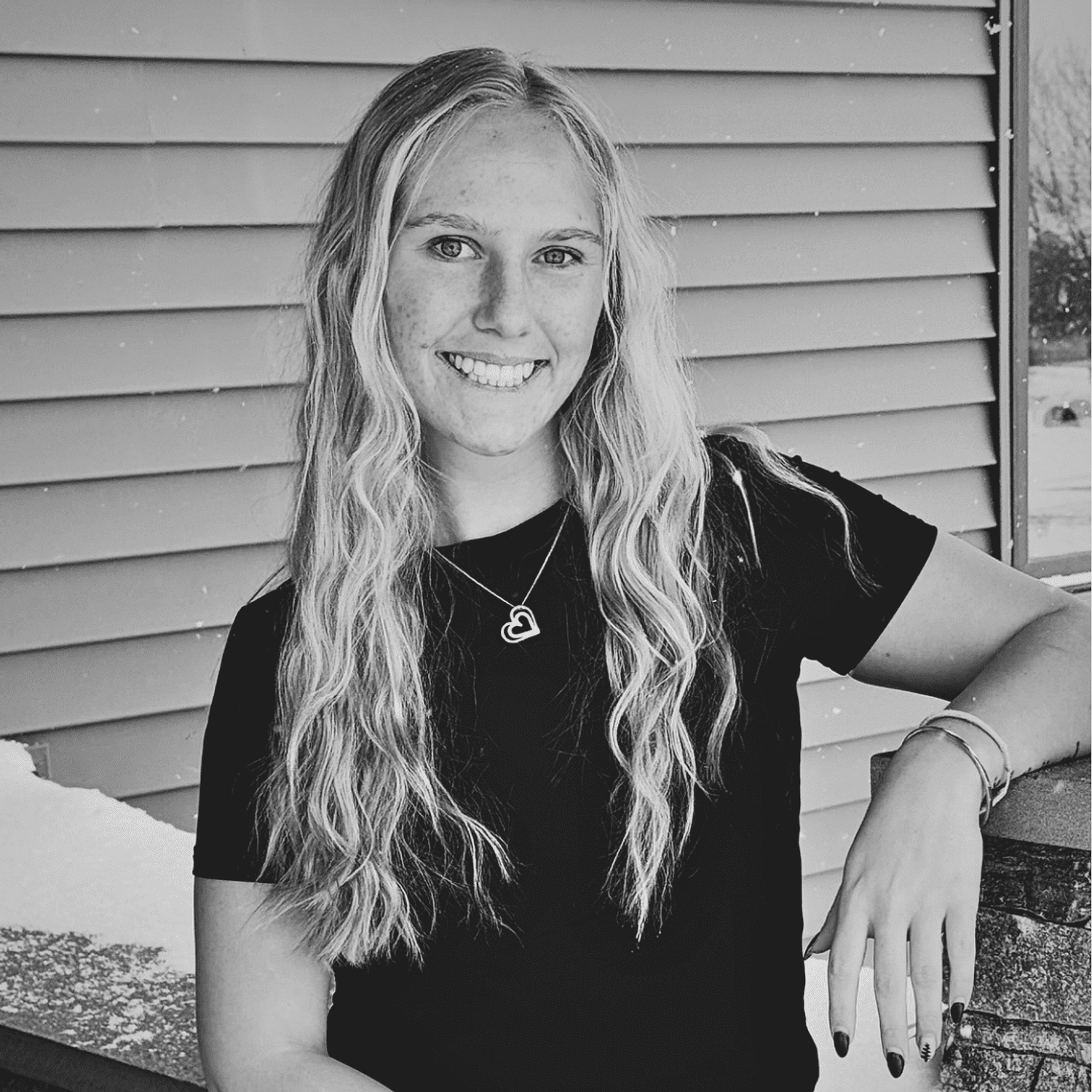 Portrait of Whitney H., a professional stylist at Revive Salon & Spa, showcasing their expertise and style.