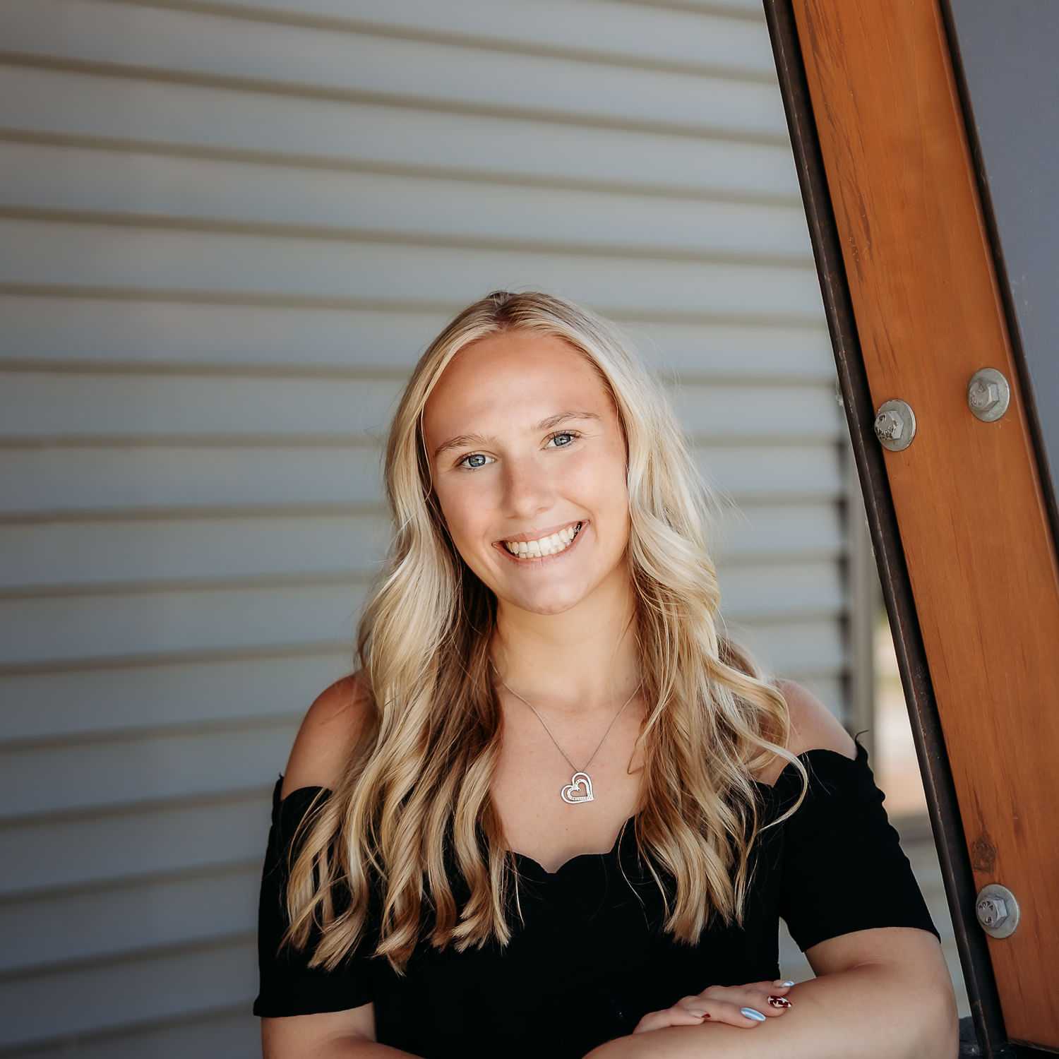 Portrait of Whitney H., a professional stylist at Revive Salon & Spa, showcasing their expertise and style.