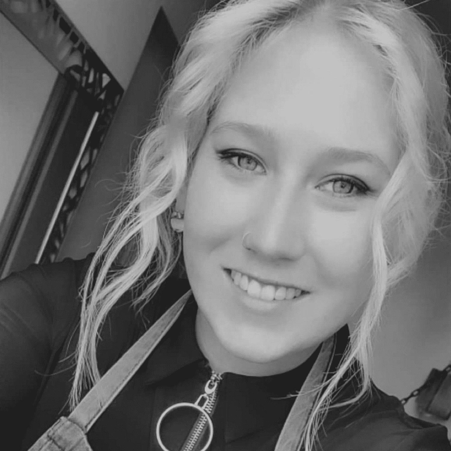 Portrait of Emma M., a professional stylist at Revive Salon & Spa, showcasing their expertise and style.