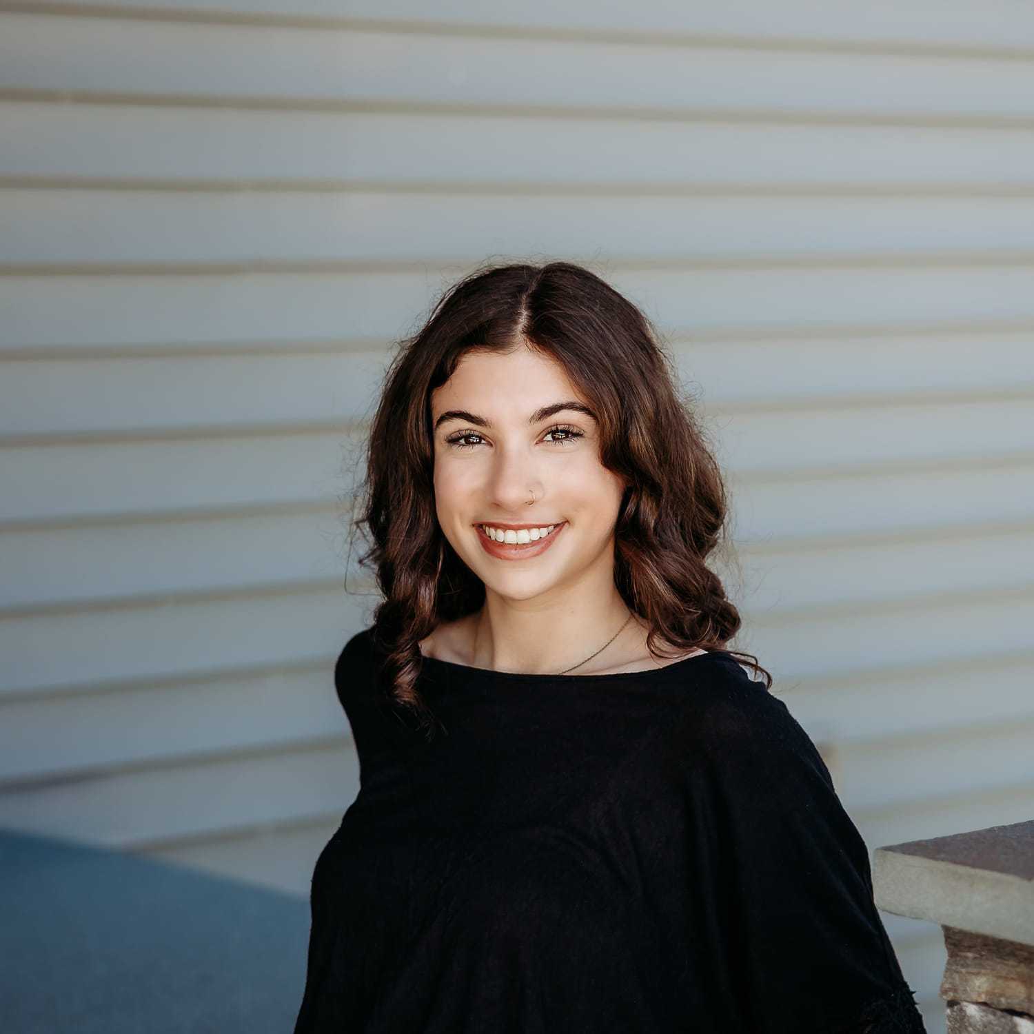 Portrait of Ryan D., a professional stylist at Revive Salon & Spa, showcasing their expertise and style.