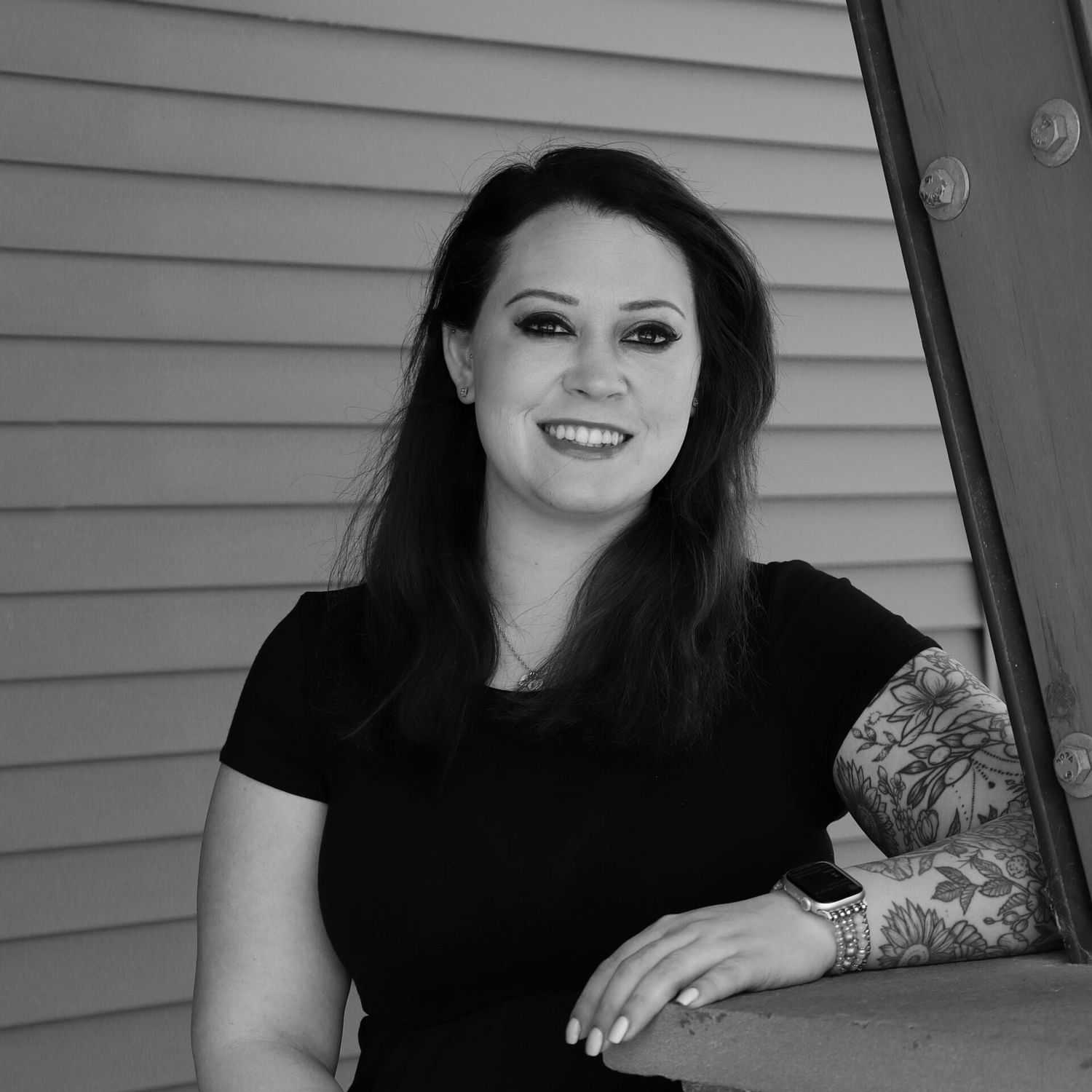 Portrait of Samantha D., a professional stylist at Revive Salon & Spa, showcasing their expertise and style.
