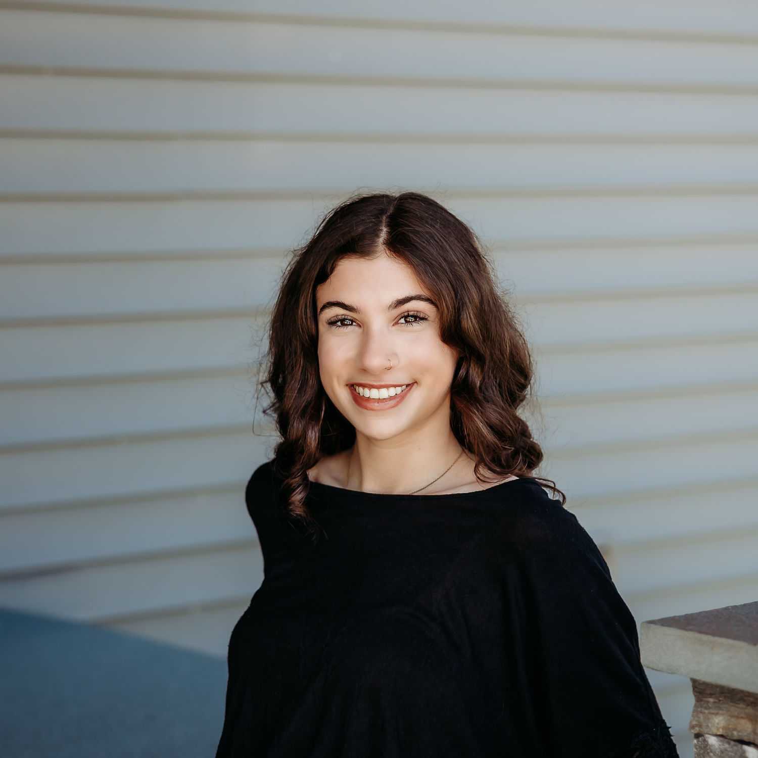 Portrait of Ryan D., a professional stylist at Revive Salon & Spa, showcasing their expertise and style.