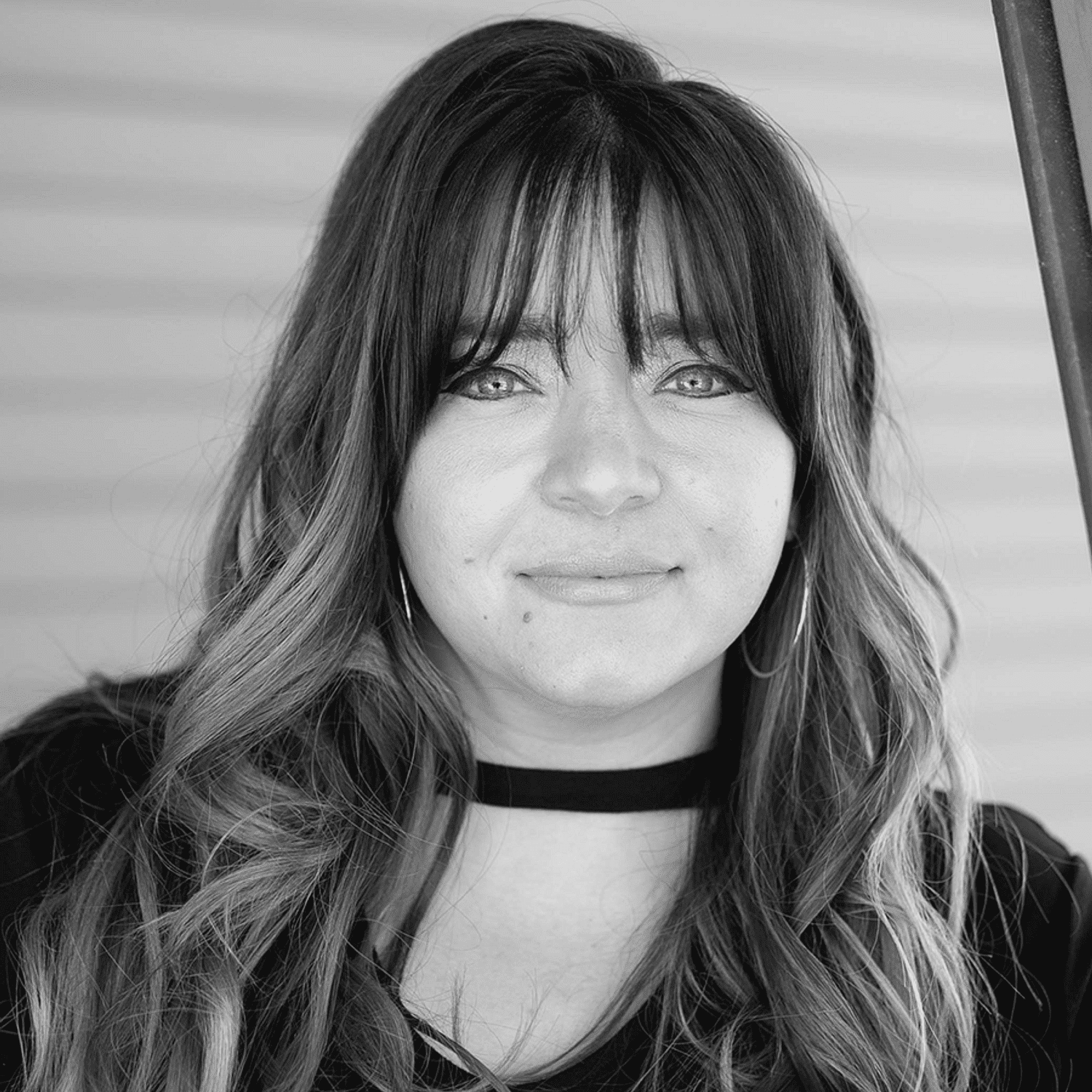 Portrait of Candice S., a professional stylist at Revive Salon & Spa, showcasing their expertise and style.