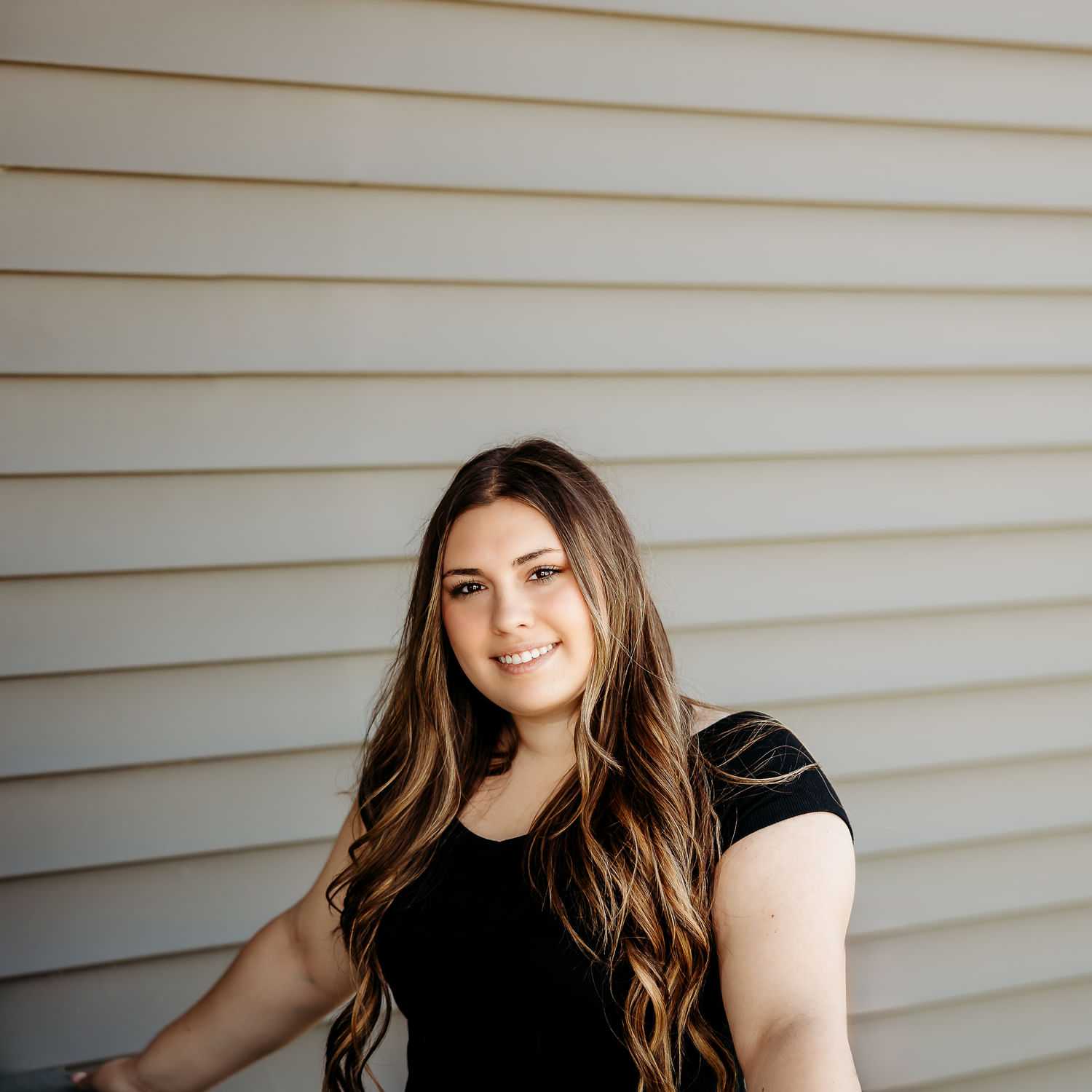 Portrait of Haley C., a professional stylist at Revive Salon & Spa, showcasing their expertise and style.