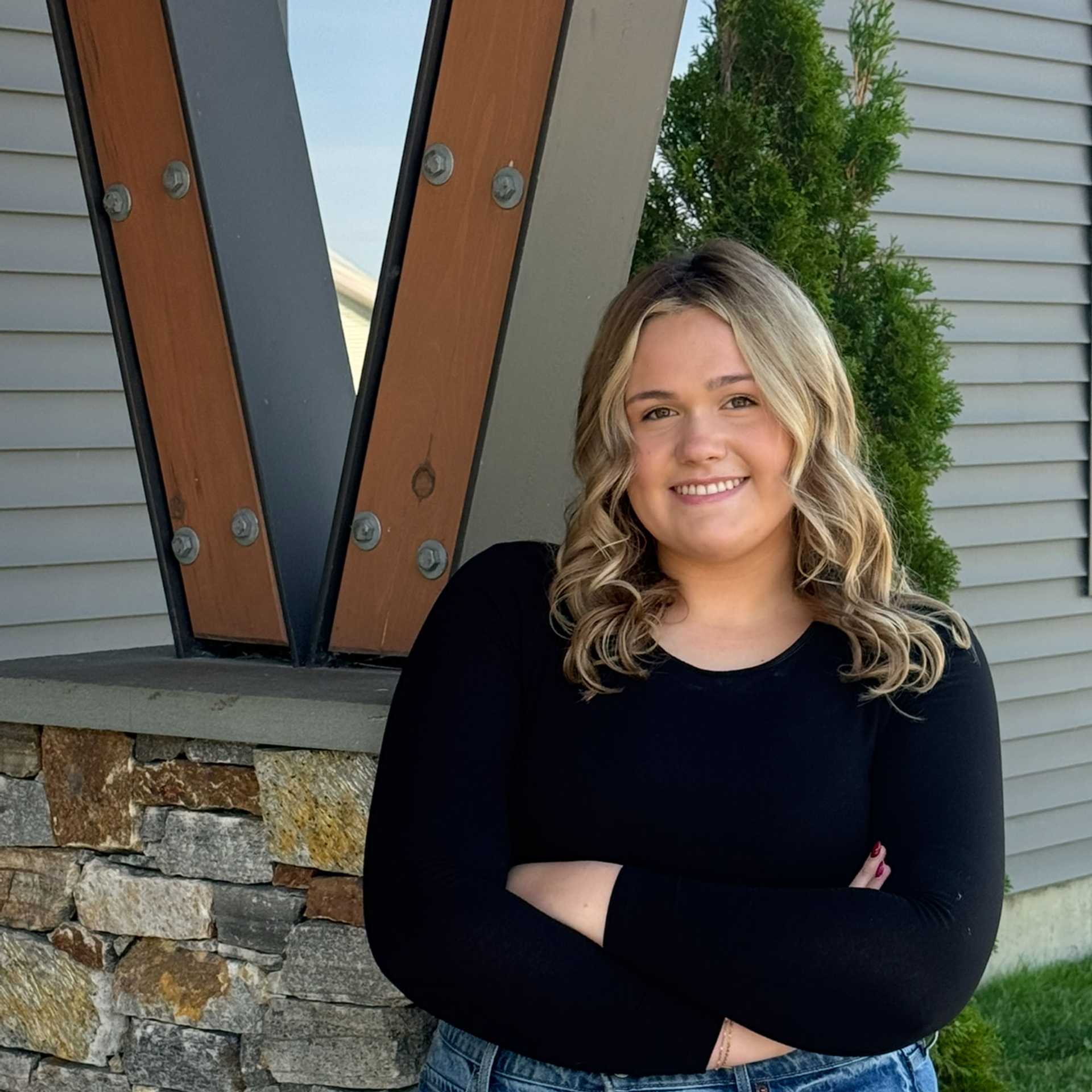 Portrait of Olivia M., a professional stylist at Revive Salon & Spa, showcasing their expertise and style.