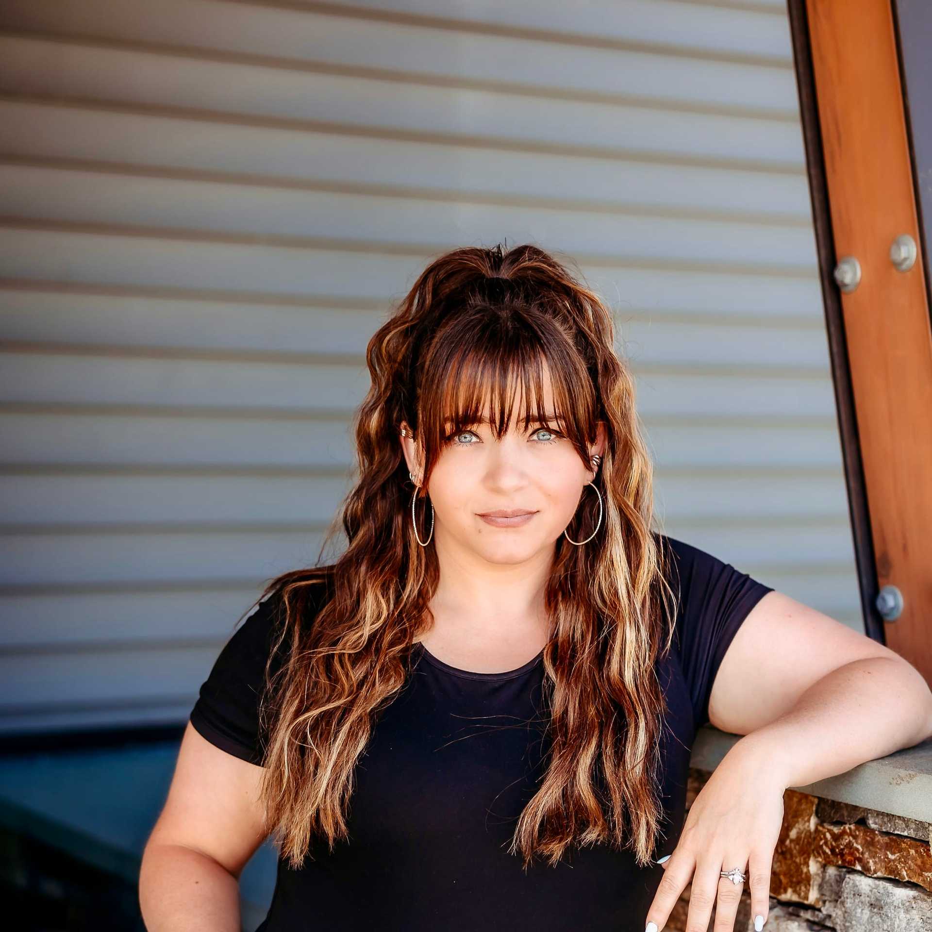 Portrait of Candice S., a professional stylist at Revive Salon & Spa, showcasing their expertise and style.