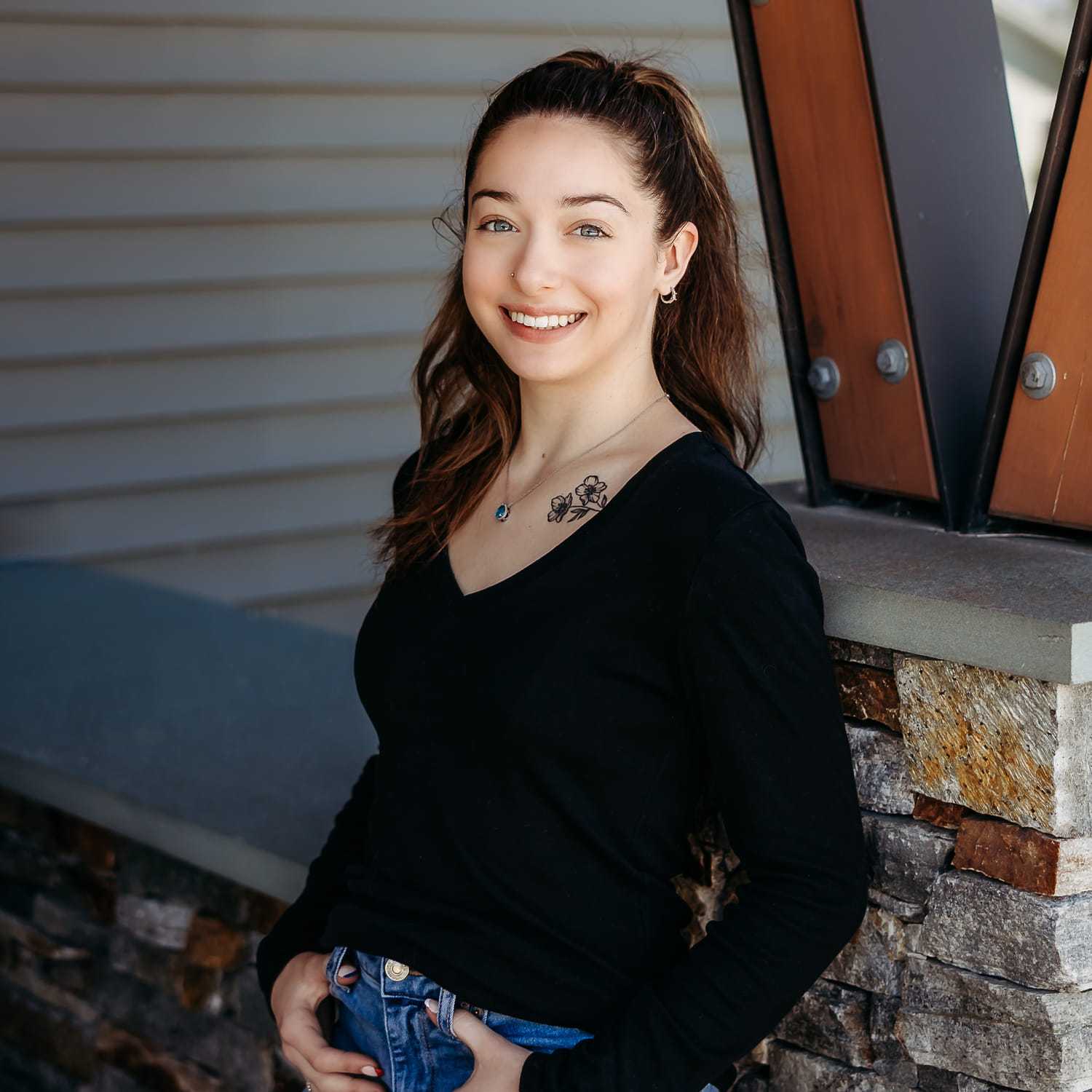 Portrait of Mackenzie A., a professional stylist at Revive Salon & Spa, showcasing their expertise and style.