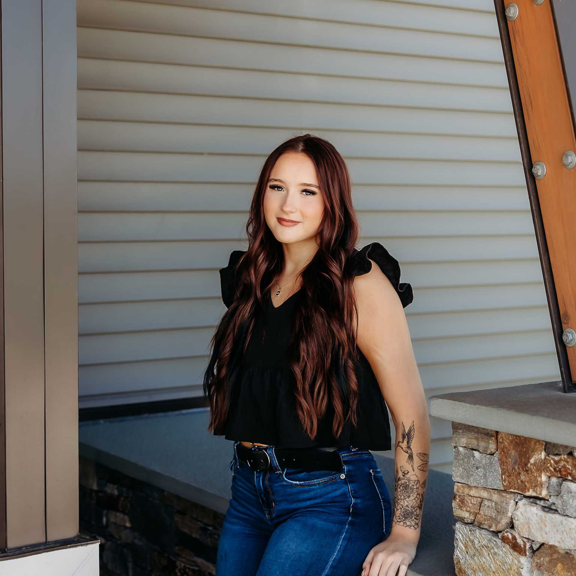 Portrait of Alexis B., a professional stylist at Revive Salon & Spa, showcasing their expertise and style.