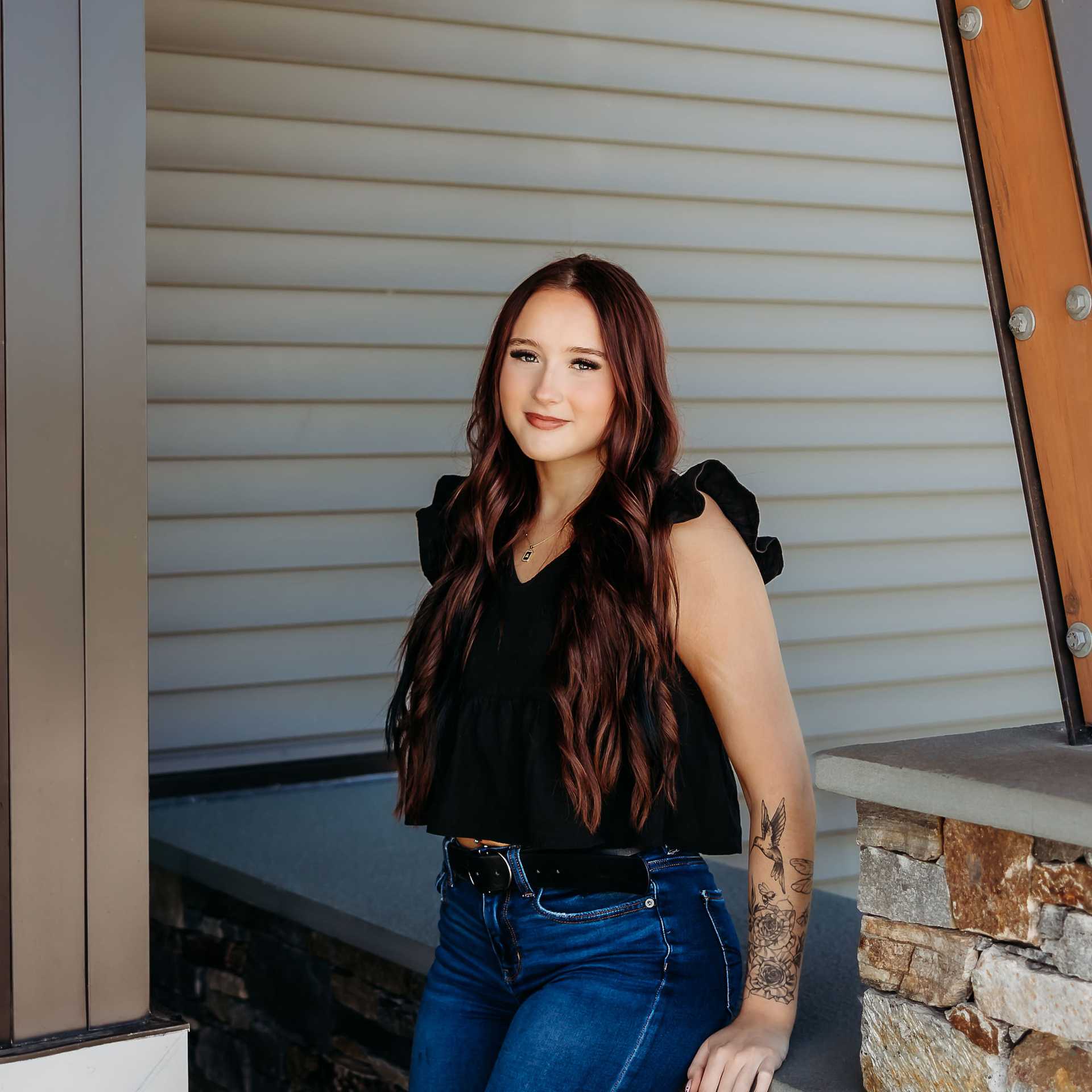 Portrait of Alexis B., a professional stylist at Revive Salon & Spa, showcasing their expertise and style.