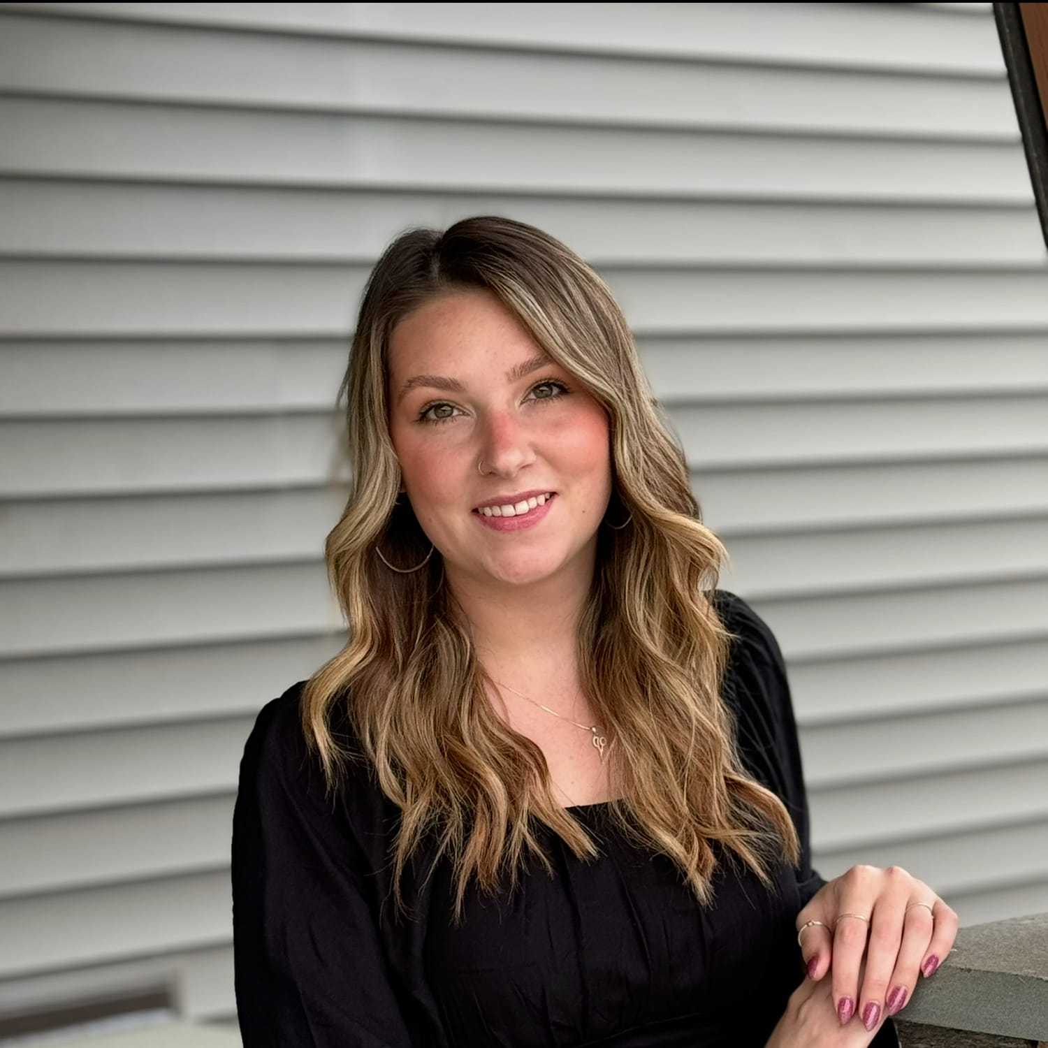 Portrait of Maci R., a professional stylist at Revive Salon & Spa, showcasing their expertise and style.