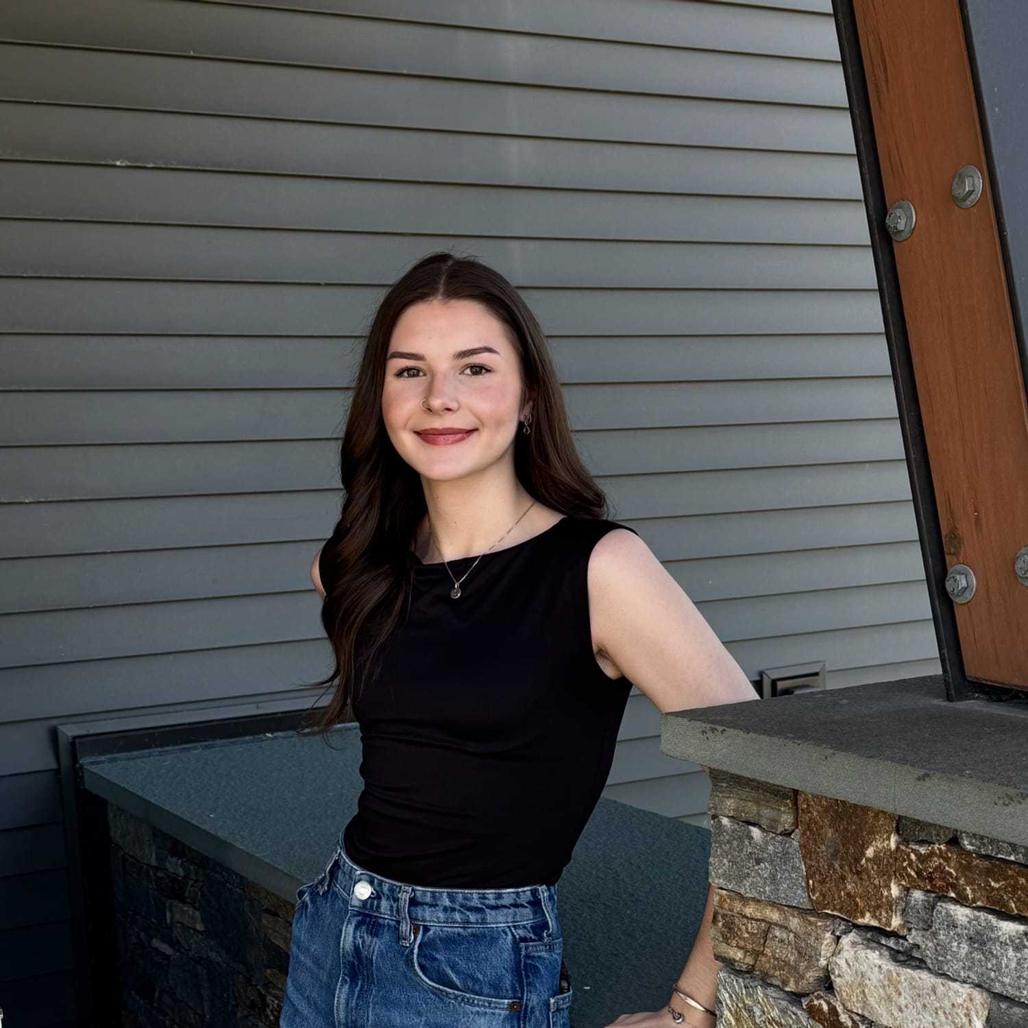 Portrait of Sophia M., a professional stylist at Revive Salon & Spa, showcasing their expertise and style.