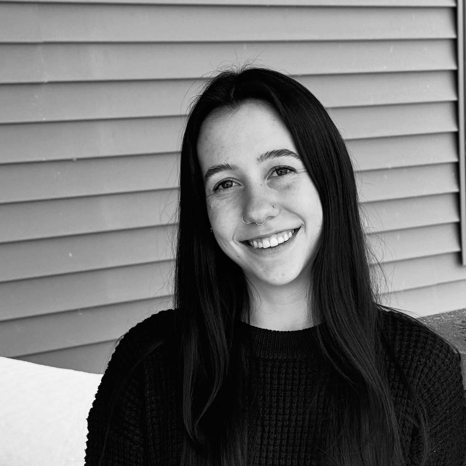 Portrait of Rosie C., a professional stylist at Revive Salon & Spa, showcasing their expertise and style.