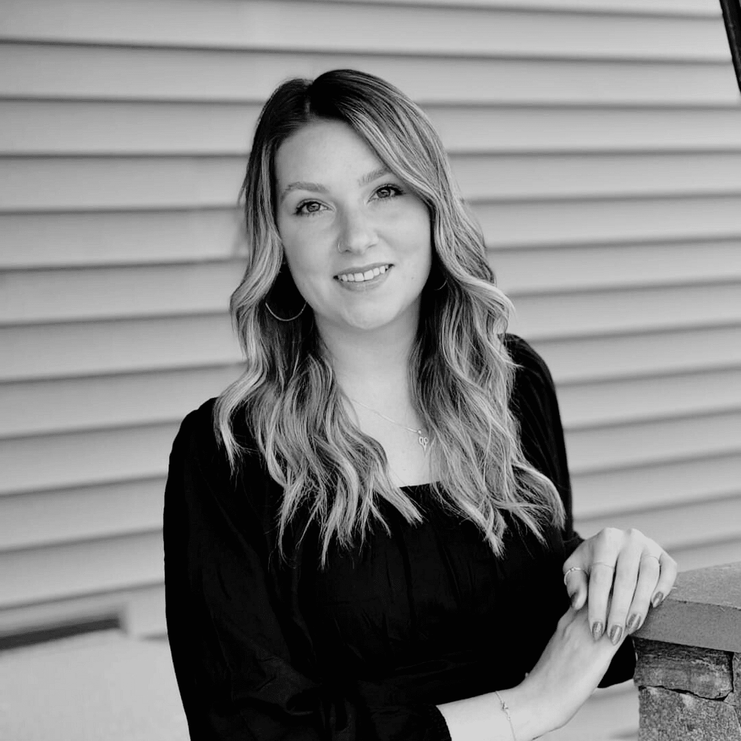 Portrait of Maci R., a professional stylist at Revive Salon & Spa, showcasing their expertise and style.